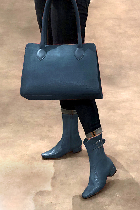 Denim blue women's ankle boots with buckles on the sides. Round toe. Low block heels. Worn view - Florence KOOIJMAN